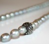 Gray freshwater pearl necklace with glittering Swarovski bead accent.