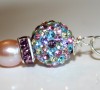 Multi colored Swarovski crystal bead with freshwater pearl on sterling silver chain.