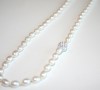 White freshwater pearl necklace set with sparkly Swarovski bead accents.